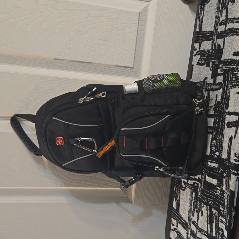 Swiss Gear Backpack,travel pack,black, red, and with durable material.